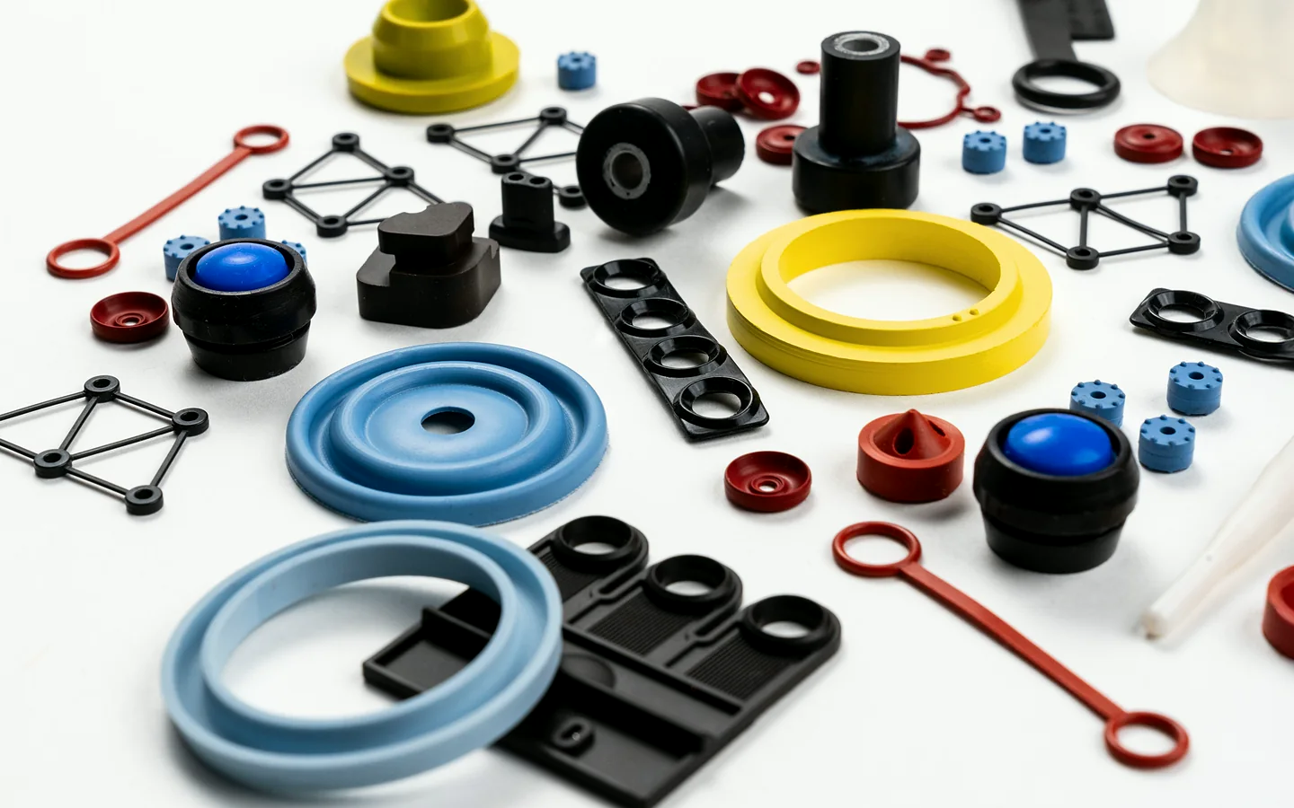 Rigid and soft molded components used in multi-material product applications