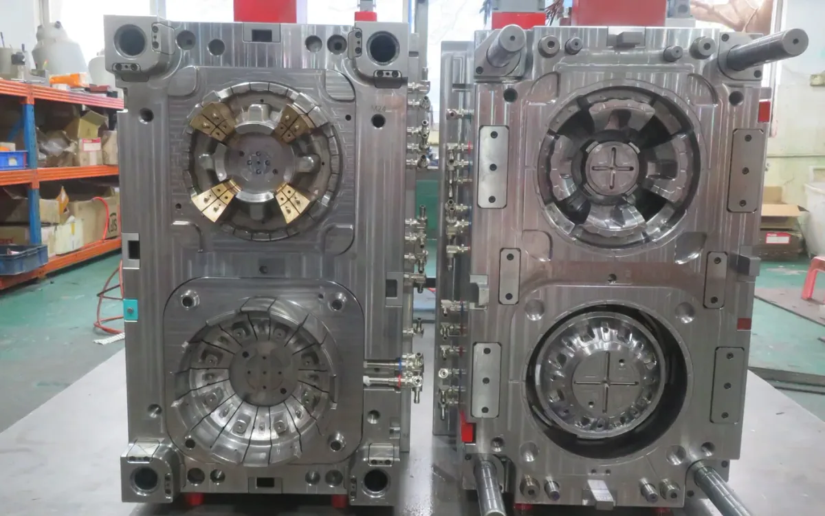 Completed hot runner injection mold with open core and cavity halves
