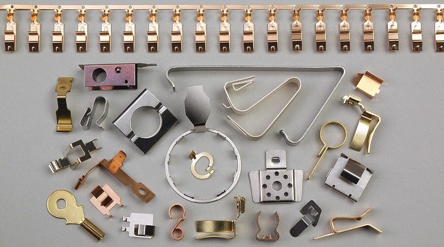 Sheet metal clips brackets and formed components arranged on a surface